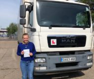 Female Learner Celebrates gaining HGV licence with Chequered Flag Training